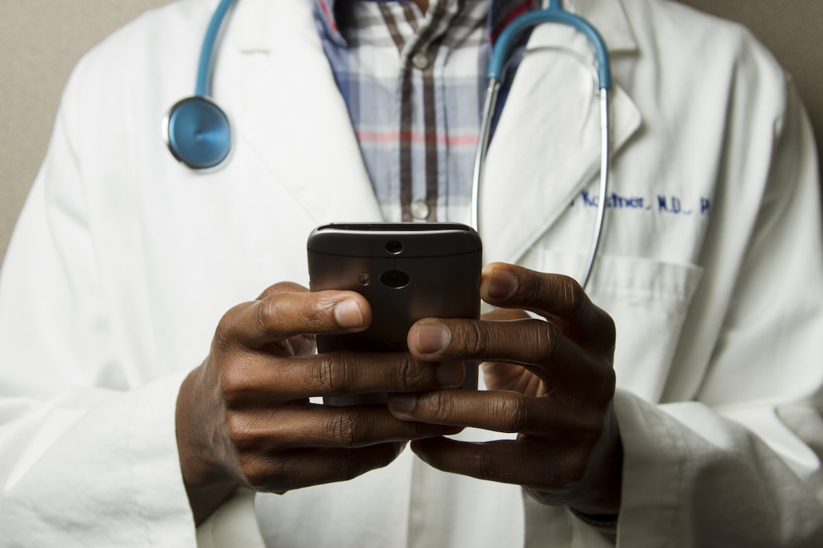 A clinician completing a consent on a phone